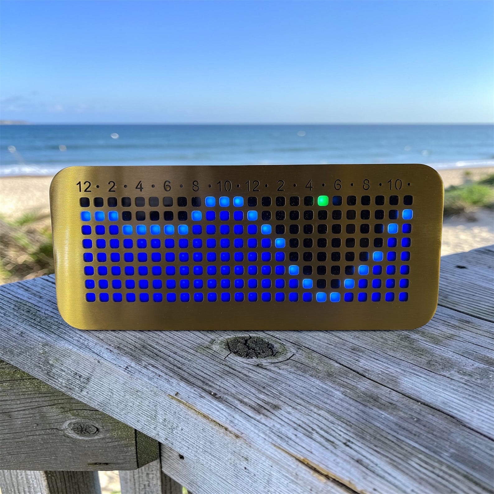 NautiKron automatic GPS tide clock overlooking the ocean