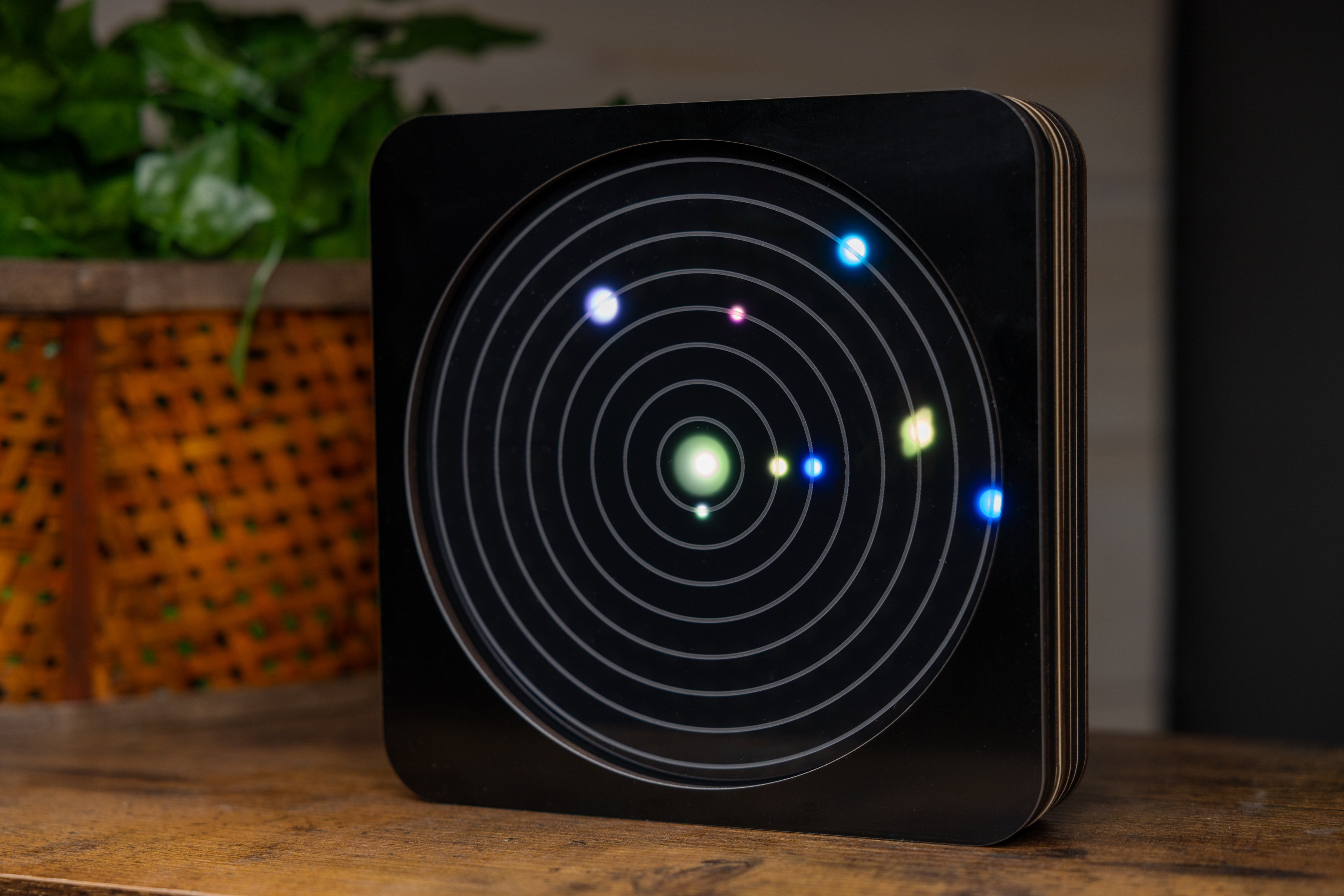 OrbiKron electronic orrery showing the planets as colored points of light